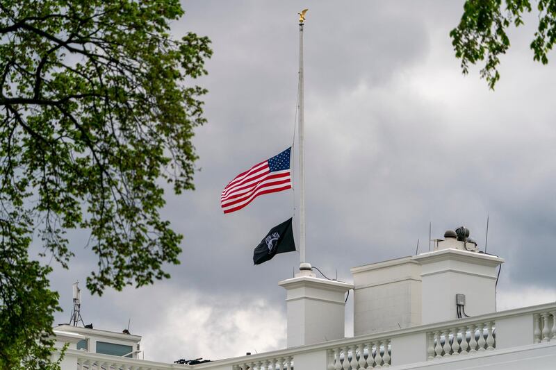 The American flag files at half-staff above the White House in Washington. AP Photo