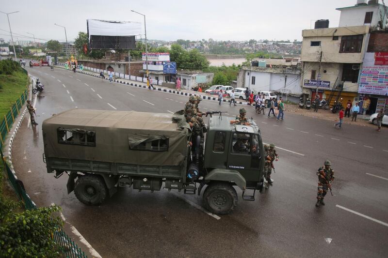 Indian army soldiers stand guard during curfew like restrictions in Jammu, India, Monday, August 5, 2019. AP Photo