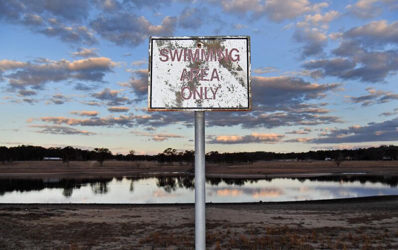 A swimming area only sign is seen at the near-empty Storm King dam near Stanthorpe in regional Queensland. AFP