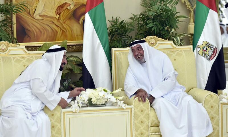 President Sheikh Khalifa bin Zayed, right, exchanges Eid Al Fitr greetings with Dr Sheikh Sultan bin Mohammed Al Qasimi, Ruler of Sharjah, at Al Bateen Palace. WAM