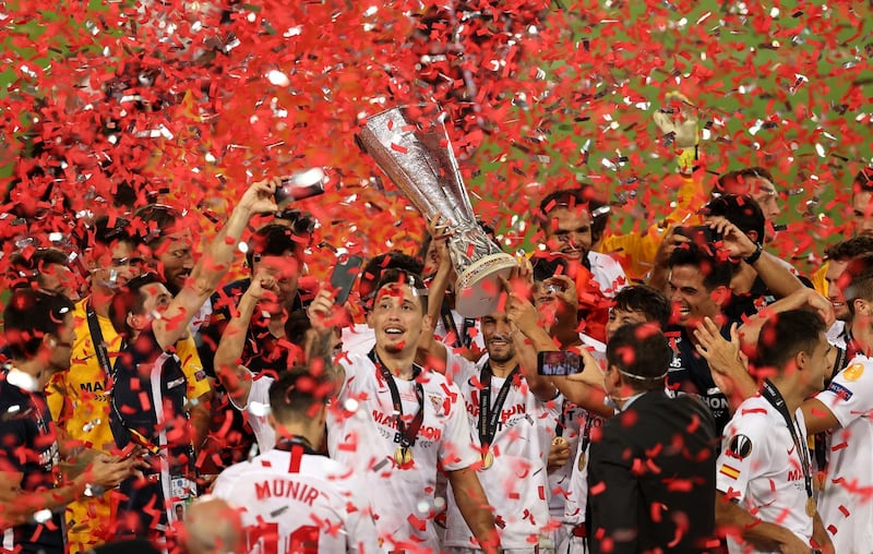 Sevilla celebrate with the Europa League trophy following their victory over Inter Milan. Getty
