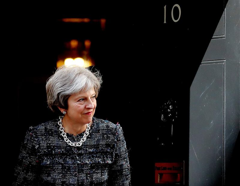 Britain's Prime Minister Theresa May leaves 10 Downing Street to meet President Ilham Aliyev of Azerbaijan for bilateral talks in London, Thursday, April 26, 2018. (AP Photo/Frank Augstein)