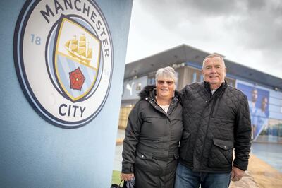 Feature on Manchester City FC at the Etihad complex and Manchester city centre.
PIC shows fans Rob Booth and Sue Booth.