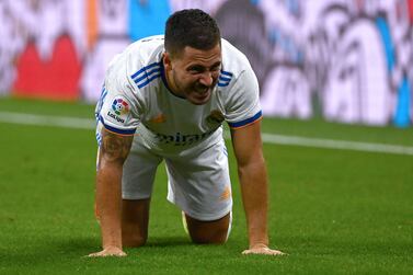 Real Madrid's Belgian forward Eden Hazard reacts after being fouled during the Spanish League football match between Real Madrid CF and RC Celta de Vigo at the Santiago Bernabeu stadium in Madrid on September 12, 2021.  (Photo by GABRIEL BOUYS  /  AFP)