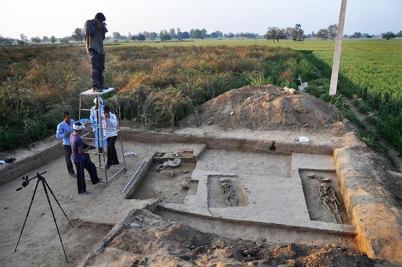 Four complete human skeletons - two men, one woman and a child - thought to date back some 5,000 years have been discovered in an ancient village in northern India.  Archaeological teams from India and South Korea have been digging since 2012 in an area of Haryana state where an ancient Indus Valley civilisation was thought to have been located.  Manoj Dhaka / AFP