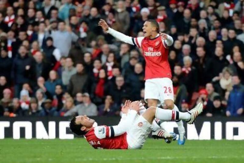 Arsenal's Santi Cazorla is awarded a penalty following a challenge by West Bromwich Albion's Steven Reid. Dylan Martinez / Reuters