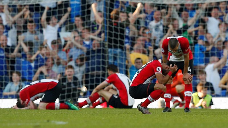 Soccer Football - Premier League - Everton vs Southampton - Goodison Park, Liverpool, Britain - May 5, 2018   Southampton players look dejected after Everton's Tom Davies scored their first goal        REUTERS/Andrew Yates    EDITORIAL USE ONLY. No use with unauthorized audio, video, data, fixture lists, club/league logos or "live" services. Online in-match use limited to 75 images, no video emulation. No use in betting, games or single club/league/player publications.  Please contact your account representative for further details.