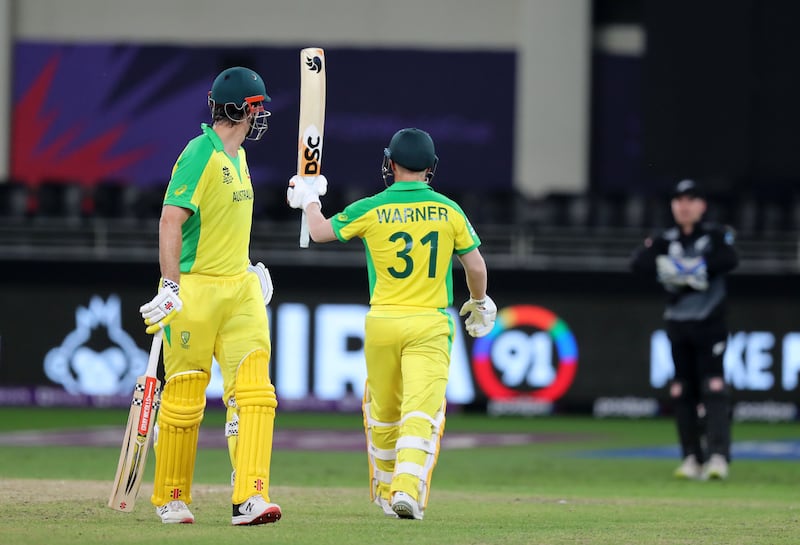 David Warner celebrates reaching fifty at the Dubai International Stadium. Chris Whiteoak / The National