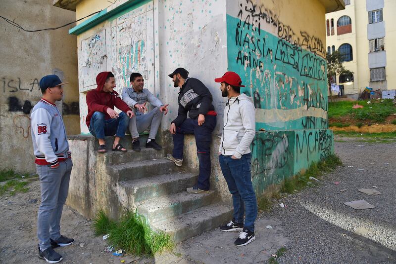 A group of young Algerians in a popular neighbourhood of the capital Algiers. The influence of the US is felt by 61 per cent of young Arabs polled in the 2021 survey. Photo: Ryad Kramdi / AFP