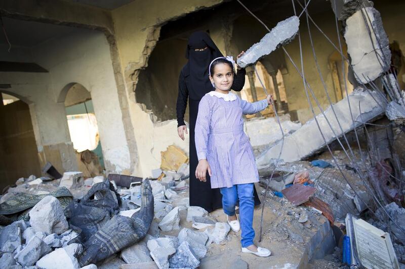 Portrait of Eman and her mother in their home, which was destroyed in one hour before the ceasefire in 'Operation Protective Edge'. 11 year old Eman suffers from lung cancer and urgently needs treatment abroad but at the time of photographing her, both borders were closed.