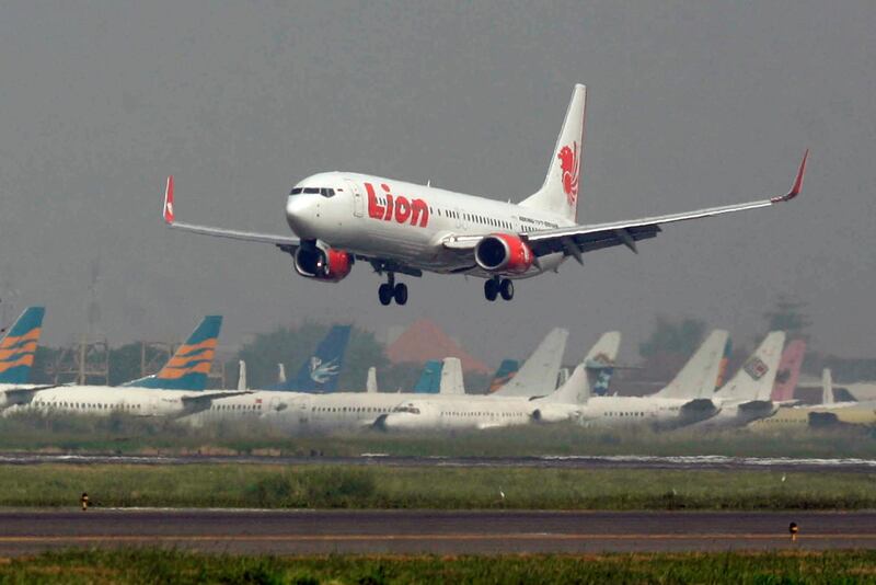 FILE - In this May 12, 2012 file photo, a Lion Air passenger jet takes off from Juanda International Airport in Surabaya, Indonesia. Indonesia's Lion Air said Monday, Oct. 29, 2018, it has lost contact with a passenger jet flying from Jakarta to an island off Sumatra. (AP Photo/Trisnadi, File)