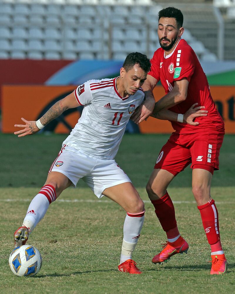 UAE forward Caio Canedo holds off Lebanon's Rabih Ataya. AFP