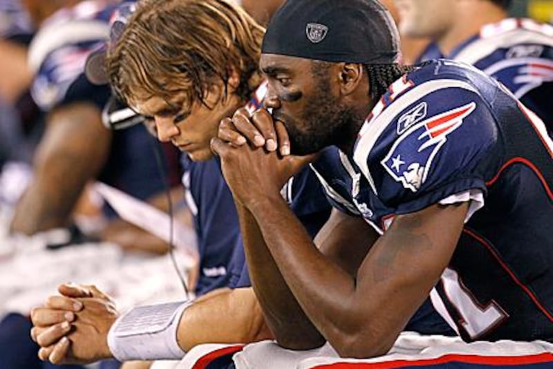 Randy Moss, right, with Tom Brady, the New England Patriots quarterback, has been traded to the Minnesota Vikings.