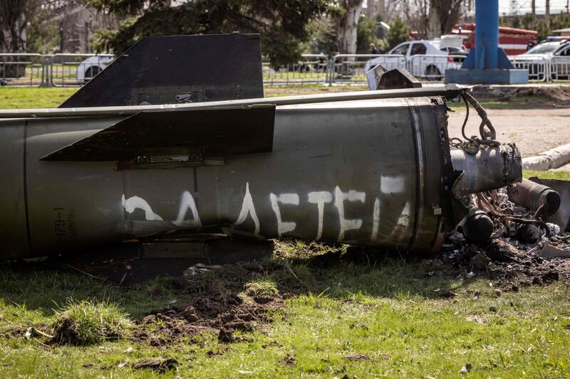 A segment of a large rocket with the words "for our children" in Russian is pictured next to the main building of the train station in Kramatorsk. EPA