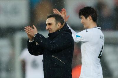Soccer Football - Premier League - Swansea City vs Burnley - Liberty Stadium, Swansea, Britain - February 10, 2018   Swansea City manager Carlos Carvalhal and Ki Sung Yueng applaud fans after the match    Action Images via Reuters/Andrew Boyers    EDITORIAL USE ONLY. No use with unauthorized audio, video, data, fixture lists, club/league logos or "live" services. Online in-match use limited to 75 images, no video emulation. No use in betting, games or single club/league/player publications.  Please contact your account representative for further details.