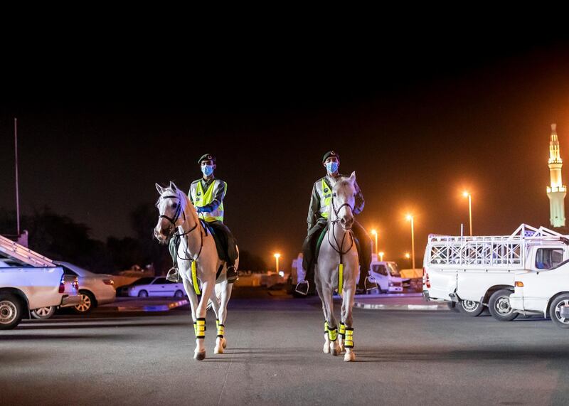 DUBAI, UNITED ARAB EMIRATES. 16 APRIL 2020. 
Dubai Mounted Police officers, in Al Aweer, patrol residential and commercial areas to insure residents are staying safe indoors during COVID-19 lockdown. They patrol the streets from 6PM to 6AM.

The officers of the Dubai Mounted Police unit have been playing a multifaceted role in the emirate for over four decades. 

The department was established in 1976 with seven horses, five riders and four horse groomers. Today it has more than 130 Arabian and Anglo-Arabian horses, 75 riders and 45 groomers.

All of the horses are former racehorses who went through a rigorous three-month-training programme before joining the police force. Currently, the department has two stables – one in Al Aweer, that houses at least 100 horses, and the other in Al Qusais, that houses 30 horses.

(Photo: Reem Mohammed/The National)

Reporter:
Section: