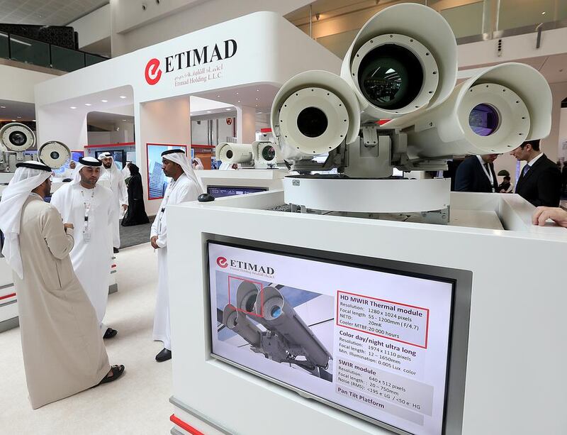 Visitors take a look at displays at the Etimad. Satish Kumar / The National