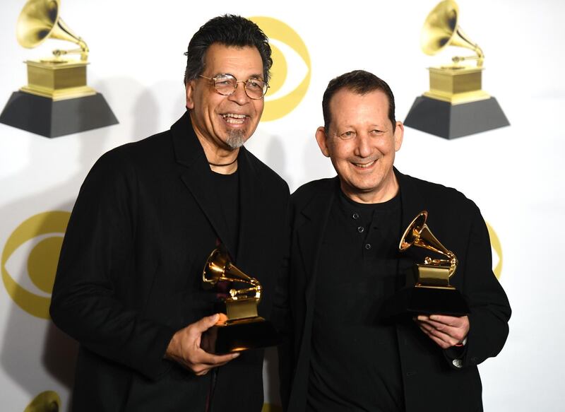 The band Jeff Lorber Fusion holds the trophy for Best Contemporary Instrumental Album, Prototype, in the press room. AFP