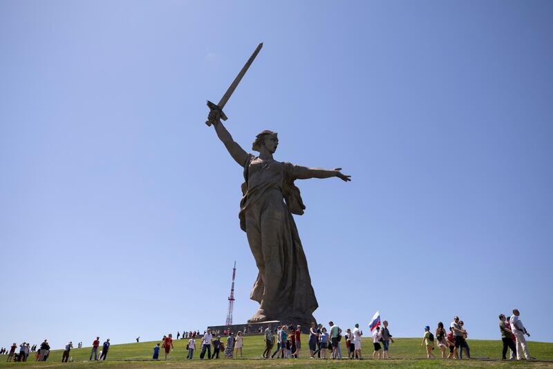 Locals and football fans in front of The Motherland Calls statue at World War II memorial complex Mamayev Kurgan, in Volgograd, Russia, on June 18, 2018. Atef Safadi / EPA