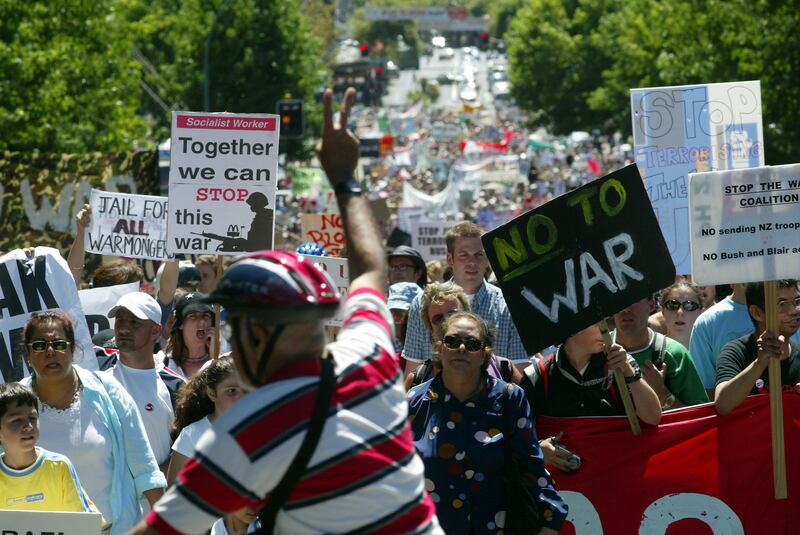 Protesters make their way up Queen Street in Auckland, New Zealand. 