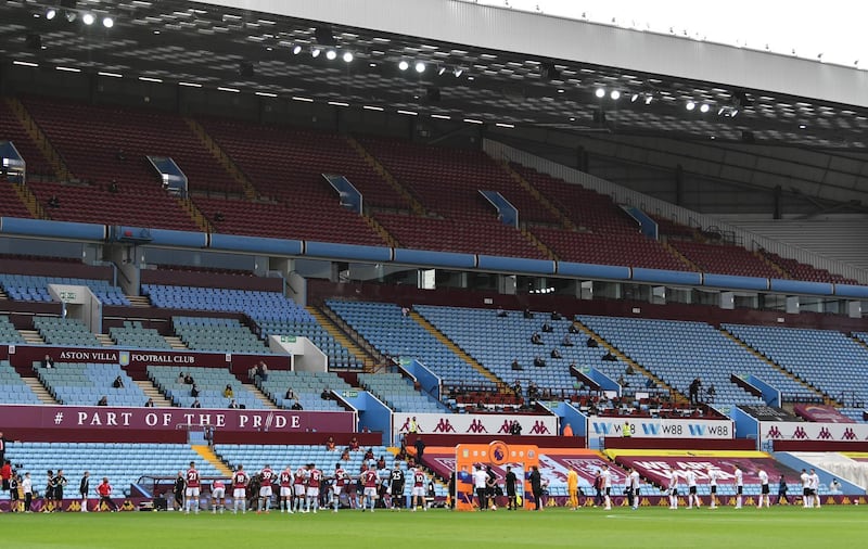 Players line up as the Premier League restarted in Villa Park behind closed door. Reuters