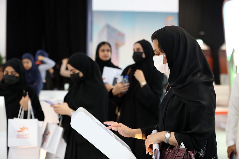 Visitors sign up for information at the Ducab stand at the UAE Careers Fair. All photos by: Chris Whiteoak / The National