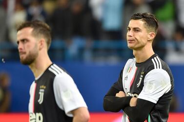 Juventus' Portuguese forward Cristiano Ronaldo (R) reacts following their defeat the Supercoppa Italiana final football match between Juventus and Lazio at the King Saud University Stadium in the Saudi capital Riyadh on December 22, 2019. / AFP / FAYEZ NURELDINE