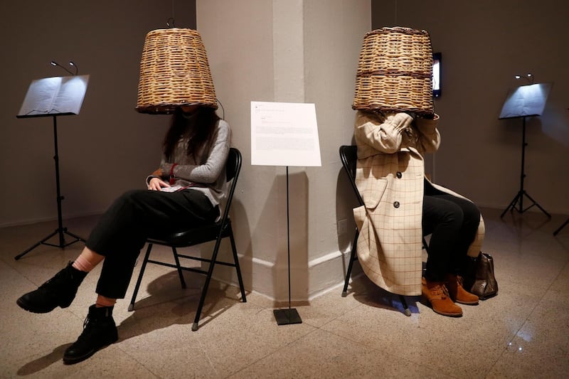 Visitors experience the installation 'Tettix' by Greek artist Phoebe Giannisi after the opening of the exhibition 'At the Beginning Was the Word. Concepts - Images - Script' at the National Art Museum of China in Beijing. EPA