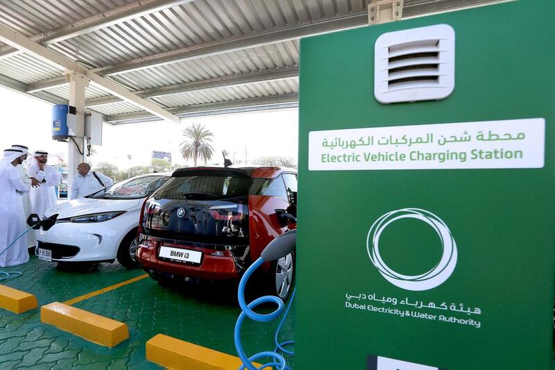 Electric vehicles are charged at Dewa’s headquarters in Dubai. Pawan Singh / The National