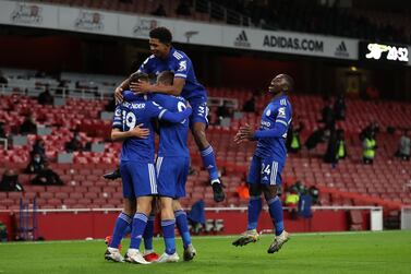 Leicester City's Jamie Vardy celebrates with his teammates after netting the winner at Arsenal. PA