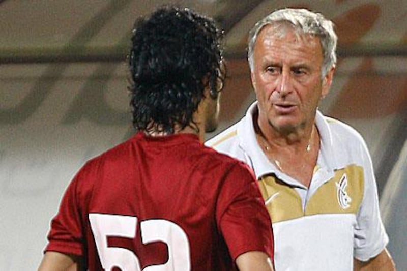 The Al Wahda coach Josef Hickersberger, right, will be down to the bare bones for three Etisalat Cup matches.