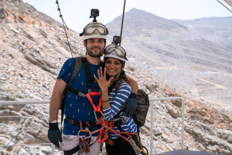 Adrian Mackay, 30, from India, rode the zipline at the weekend before getting down on one knee as Susan Kuruvilla, also from India, came into land on the 80m-high suspended platform on Jebel Jais, the UAE’s tallest mountain.  She said yes. Photo / Supplied 