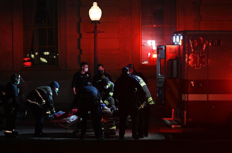 Paramedics perform cardiopulmonary resuscitation on a patient. AFP