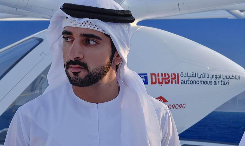 A handout image provided by United Arab Emirates News Agency (WAM) on September 25, 2017 shows Sheikh Hamdan bin Mohammed bin Rashid al-Maktoum, Crown Prince of Dubai, attending the launch of a prototype "hover-taxi" service in Dubai.
Dubai has edged closer to its goal of launching a pioneering hover-taxi service, as a prototype two-seater driverless aircraft, supplied by Germany-based Volocopter, flew on a "concept" flight without passengers on September 25, 2017. / AFP PHOTO / WAM / Handout / === RESTRICTED TO EDITORIAL USE - MANDATORY CREDIT "AFP PHOTO / HO / WAM" - NO MARKETING NO ADVERTISING CAMPAIGNS - DISTRIBUTED AS A SERVICE TO CLIENTS ===