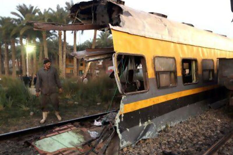 The wreckage of a train in the Giza neighbourhood of Badrashin, about 40km west of Cairo. The crash killed 17 people and injured 105.