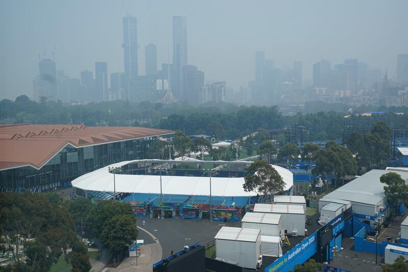 A general view of the city skyline shrouded by smoke haze from bushfires during an Australian Open practise session at Melbourne Park, on Tuesday, January 14. Reuters