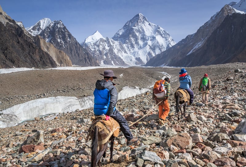 Tourists riding horses on the Godwin-Austen glacier, on the route between Concordia and K2 base camp in Pakistan. Photo: Getty