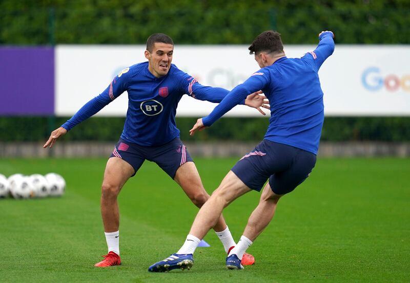 England's Conor Coady, left, and Declan Rice attend a training session at the Hotspur Way Training Ground. AP