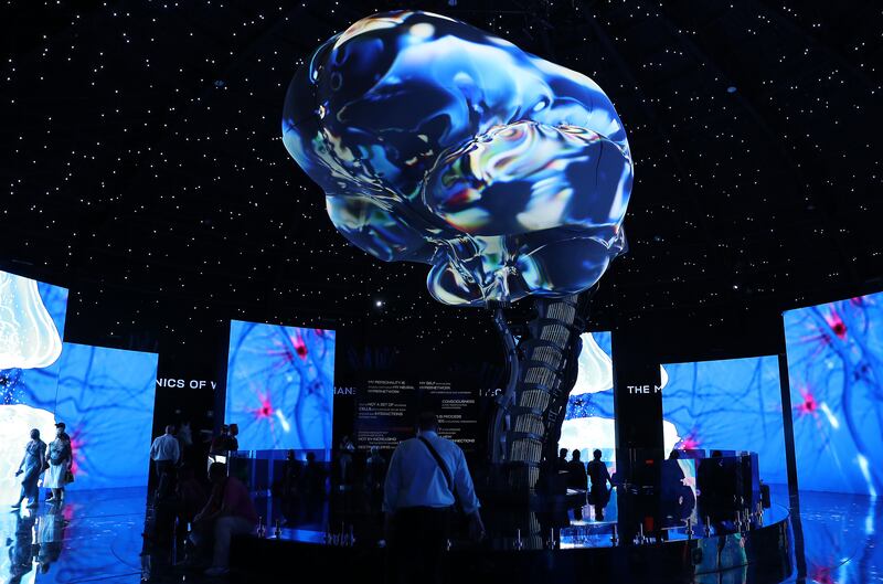 Visitors watch an audio visual show at the Russia pavilion. Pawan Singh / The National