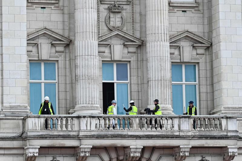 Workers prepare the balcony of Buckingham Palace for the big event. AFP