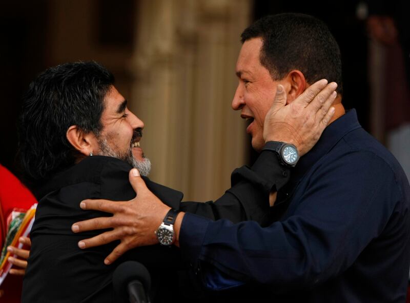 FILE - In this July 22, 2010 file photo, Argentina's Diego Armando Maradona, left, and Venezuela's President Hugo Chavez, embrace upon Maradona's arrival to the Miraflores presidential palace in Caracas, Venezuela. On Monday, Aug. 7, 2017, Maradona made a post on Facebook reading: "We are Chavistas to the death." He also wrote that if Maduro were to order it, he would "dress as a soldier for a free Venezuela, to fight imperialism." (AP Photo/Fernando Llano, File)