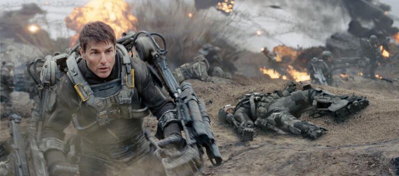 Tom Cruise plays a cowardly US army officer who is forced into combat in Edge of Tomorrow. Warner Bros Pictures / AP Photo