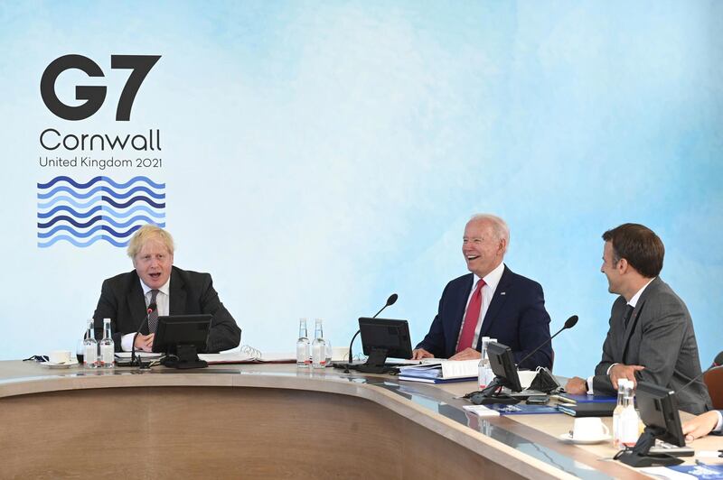 British Prime Minister Boris Johnson with US President Joe Biden and French President Emmanuel Macron, right, during the G7 summit. AP