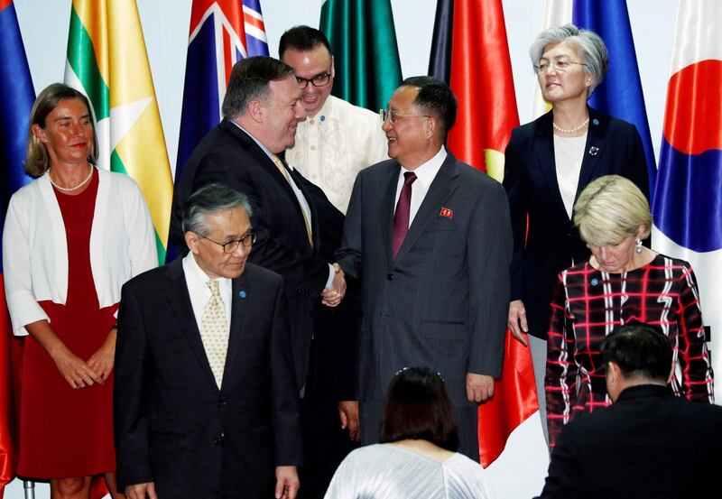 FILE PHOTO - U.S. Secretary of State Mike Pompeo shakes hands with North Korea's Foreign Minister Ri Yong Ho at the Asean Regional Forum Retreat in Singapore August 4, 2018. REUTERS/Edgar Su/File Photo