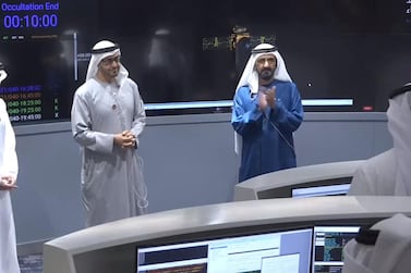 Mohamed Bin Zayed, Crown Prince and Deputy Supreme Commander of the Armed Forces, centre, and Mohammed Bin Rashid, Vice President and Ruler of Dubai, right, congratulate the team at Mohammed Bin Rashid Space Centre that sent the Hope Probe to Mars