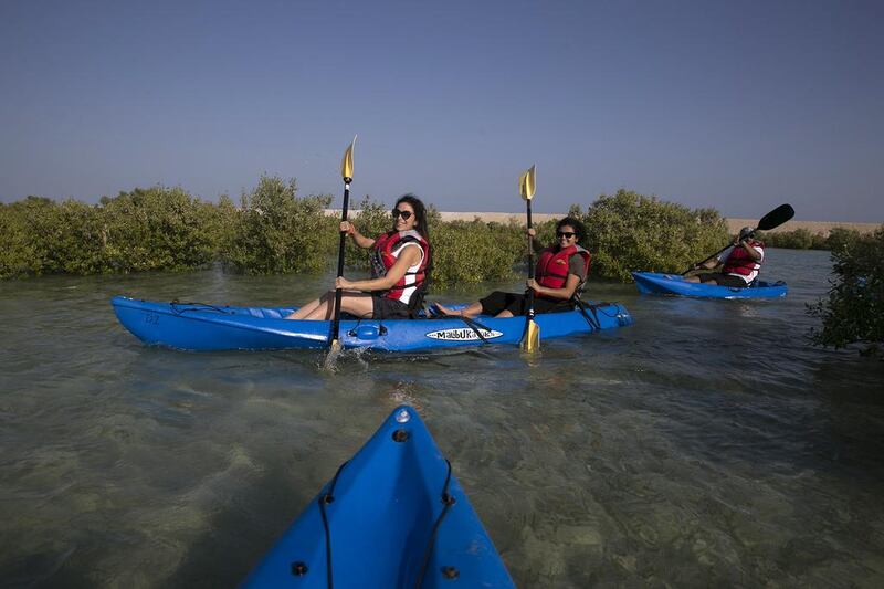 Visitors kayaking on Sir Bani Yas Island. Silvia Razgova / The National