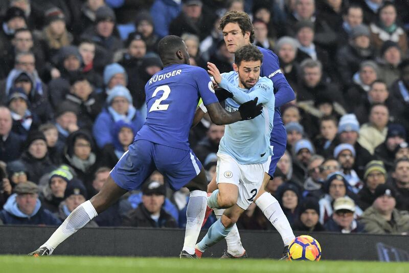 Manchester City's Portuguese midfielder Bernardo Silva (C) is marked by Chelsea's German defender Antonio Rudiger (L) and Manchester City's Spanish midfielder Manuel Garcia Alonso during the English Premier League football match between Manchester City and Chelsea at the Etihad Stadium in Manchester, north west England on March 4, 2018. / AFP PHOTO / Anthony Devlin / RESTRICTED TO EDITORIAL USE. No use with unauthorized audio, video, data, fixture lists, club/league logos or 'live' services. Online in-match use limited to 75 images, no video emulation. No use in betting, games or single club/league/player publications.  / 