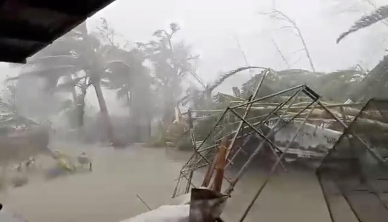 Strong winds and heavy rain batter a flooded landscape as the Typhoon Kammuri hits Gloria, Oriental Mindor, Philippines. Reuters