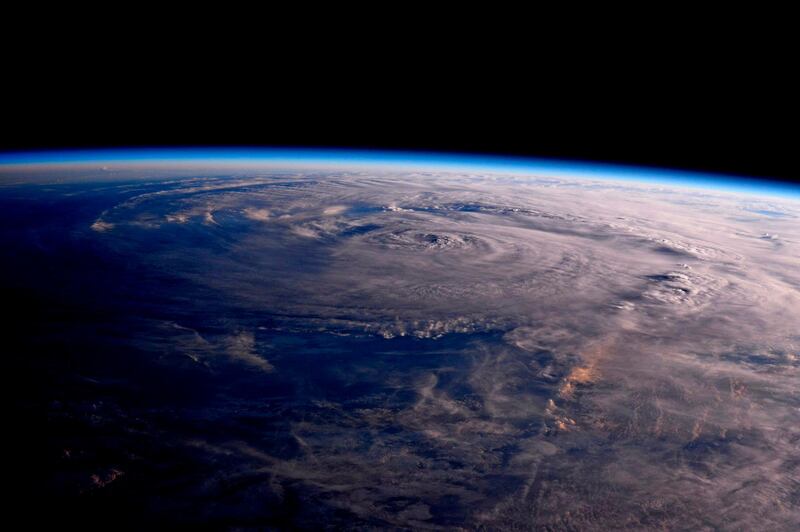 This photo made available by NASA shows Hurricane Harvey over Texas on Saturday, Aug. 26, 2017, seen from the International Space Station. Jack Fischer / NASA via AP