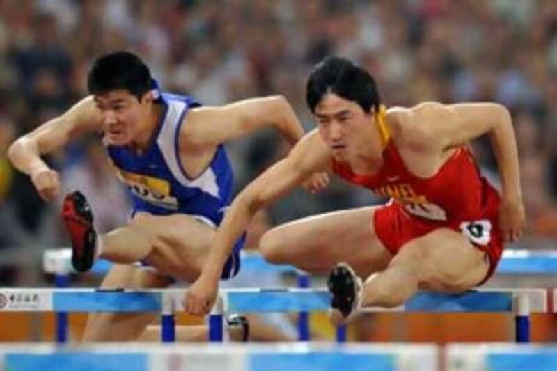 Liu Xiang, right, won gold in Athens at the 2004 Olympics for China.